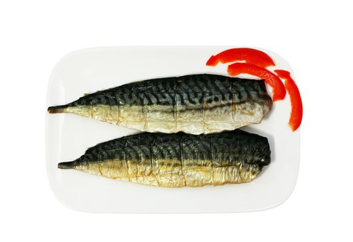 halfs of smoked mackerel on the plate isolated