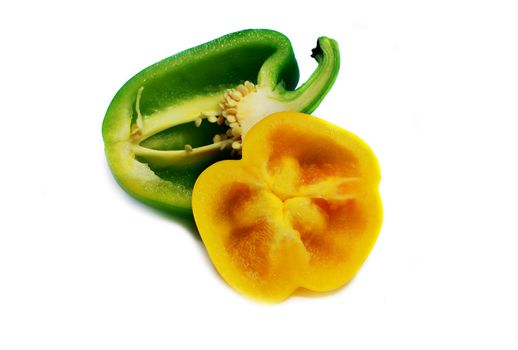 cut green and yellow sweet peppers isolated