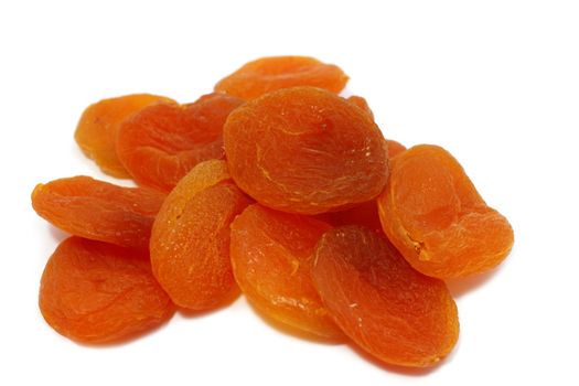 a few dried apricots close up on white
