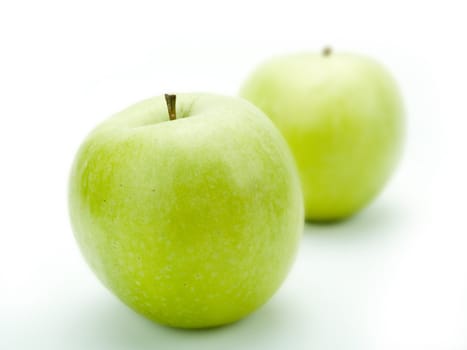 Green apples on a white background