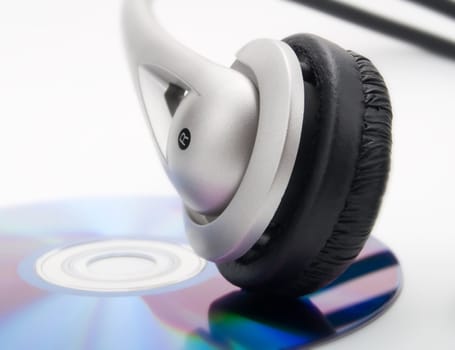 Headphones and cd on a white background