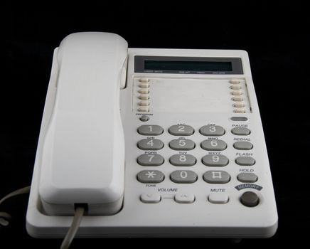 Analog phone on a black background