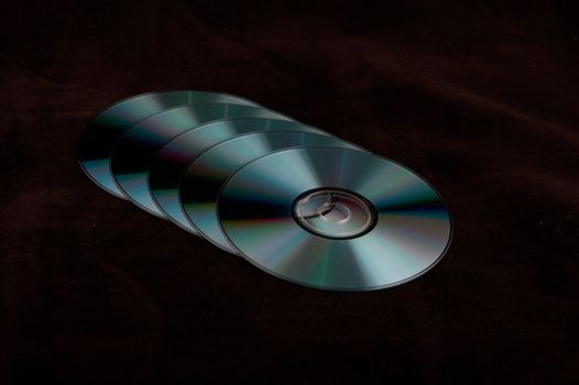 CD-R disks on a black background