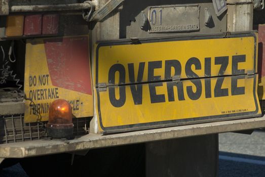 sign on the back of an oversize truck