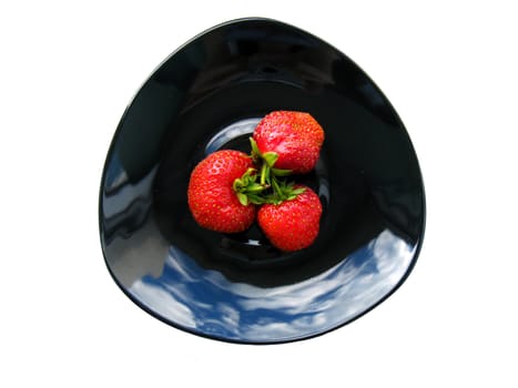 Juicy strawberries on plate