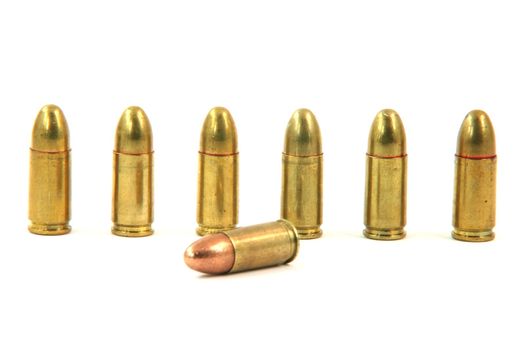 seven bullets isolated on white background weapons ammo