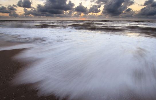 Evening at the beach, waves with motion blur