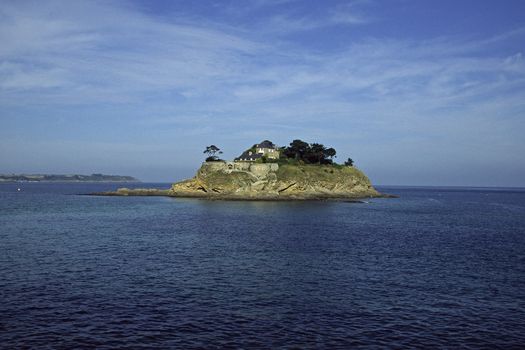 Anse du Guesclin, Pointe du Grouin with a castle is on an little island in Brittany, North France
