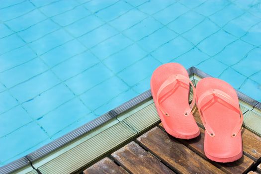 Red Flip Flops by the pool.