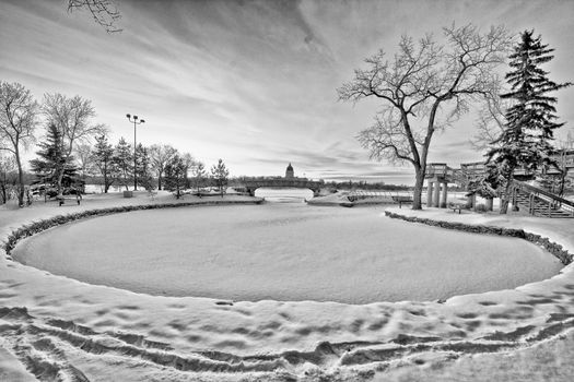 Wascana lake in Regina, Saskatchewan frozen during the cold winter days in November