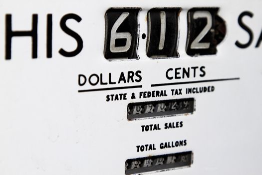 vintage gasoline pump with metering and pricing per gallons.