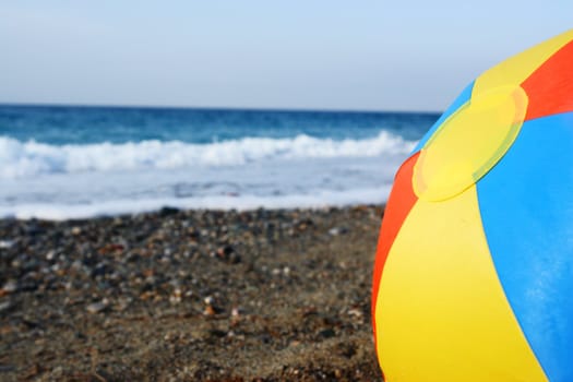 bright multicolored beach ball on the beach