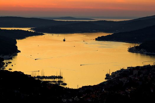 Island of Losinj bay reflection at sunset with boats, Croatia