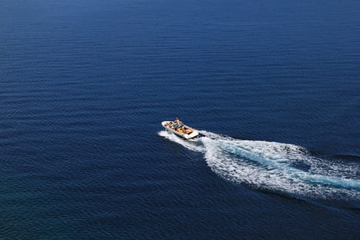 Speed boat aerial view on blue open sea water