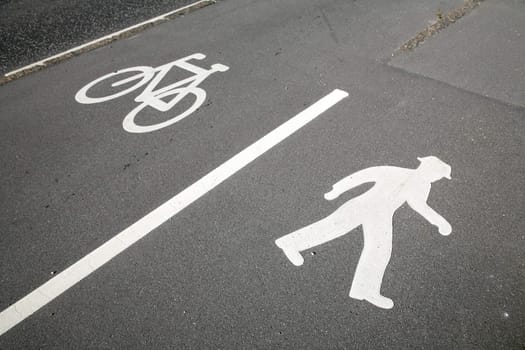 Urban signs painted on tarmac.