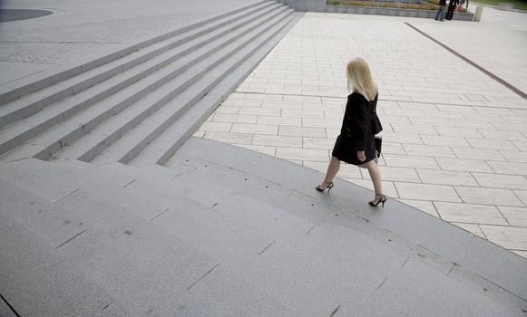 Young business woman on her way to a meeting La Defense, Paris - France.