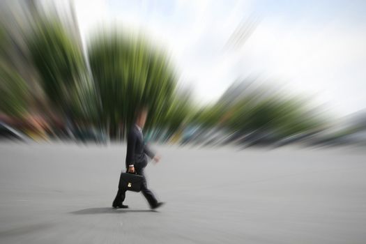 Businessman hurrying on his way to an appointment in city. Space for text.