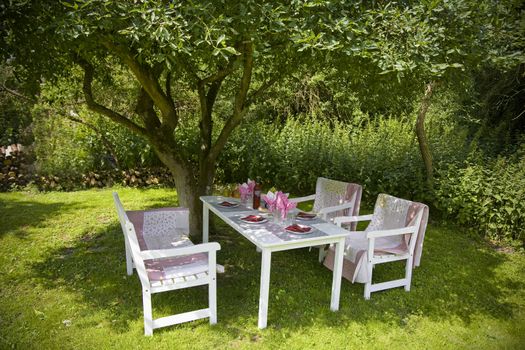 A nice place in the shade for lunch in the garden on a warm summer day -  Denmark.