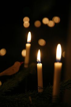 Detail from a christmas tree. Focus on candle in the middle. Shallow DOF.