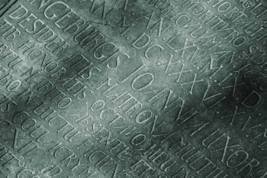 Detail of a very old interior gravestone with text in latin - Denmark.