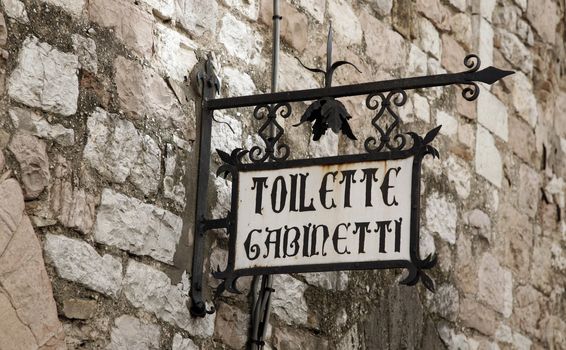 Old toilette sign - Assisi - Umbria, Italy.