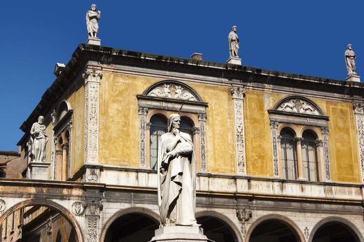 Photo of Dante square in Verone, in the foreground with the white statue of Dante Alighieri