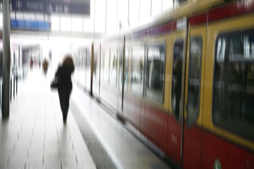 Stressed female taking the S-train - Berlin, Germany. Motion blur.