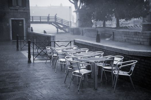 It is raining cats and dogs in Venice, Italy - Duotone.