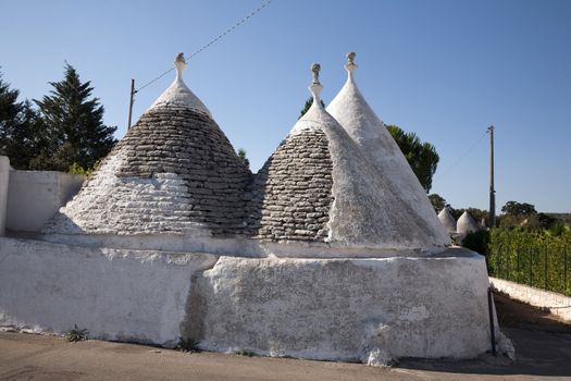 Trulli villa in the countryside near Alberobello (Bari, Apulia - Italy).
A trullo is a traditional Apulian stone dwelling with a conical roof. The style of construction is specific to Itria Valley (Valle d'Itria), in the Murge area of the Italian region of Apulia.
