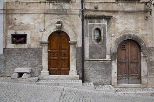 Nice facades in steep alley. The mountain village - about 1400 m above sea - Pescocostanzo in the region of Abruzzo, Italy