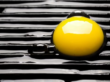 close up of a raw egg on a grill