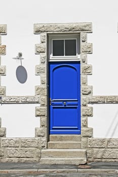 A blue door near Larmor-Plage, Brittany, North France.