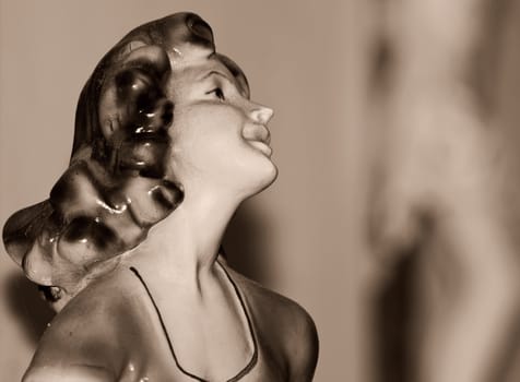 Detail of porcelain fifties style statue of female figure