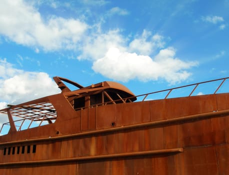 Rusty yacht and blue sky