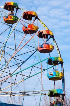 silhouette of colorful joy wheel in amusement park