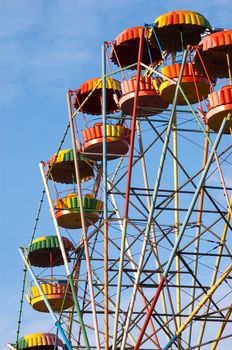 silhouette of colorful joy wheel in amusement park