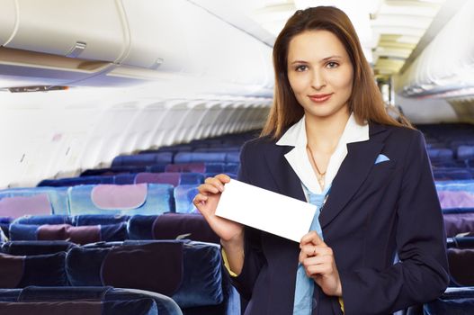 air hostess (stewardess) in the empty airliner cabin