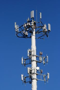 communications tower with worker repairing