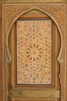 Ornate painted woodwork in the 19th century El Bahia Palace in Marrakesh, Morocco.