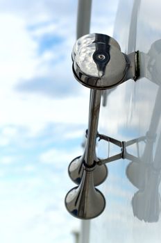 Boat horn reflecting off yacht