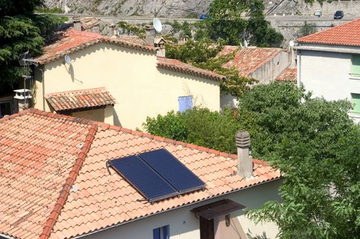 Heat solar water installed on a roof of Anduze, French city in the south-east of France.