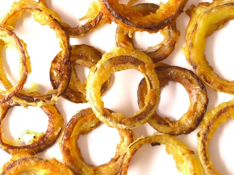 close up of onion rings on white