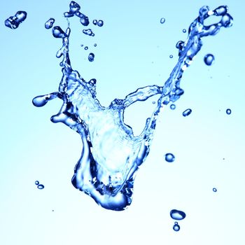 Water splash. Water splashing on blue and white background. closeup of water. Photo.