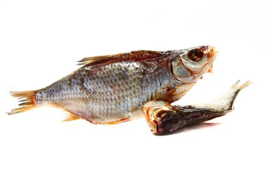 Composition from two dried fishes on a white background