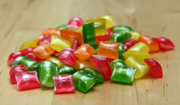 Candies on wood background