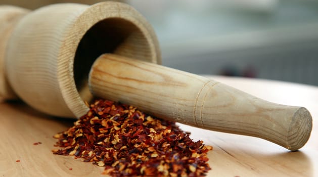 Hot chilli pepper fresh with wood pestle