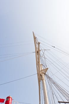 Mast of a sailing vessel is a tall, vertical, or near vertical, spar, or arrangement of spars, which supports the sails.