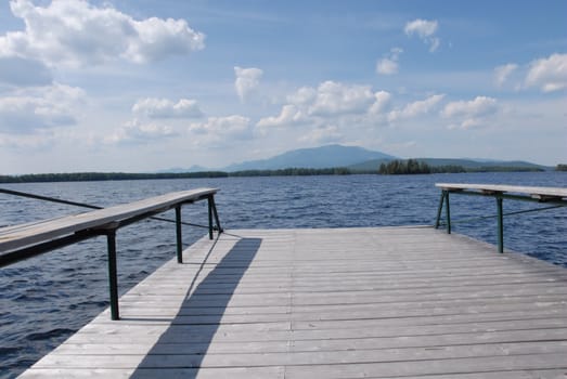 A dock overlooking Lake Millinocket with a view of Mt. Katahdin in Maine.