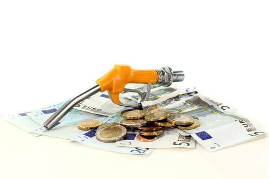 fuel nozzle and euro notes on a white background