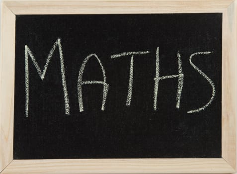 A black board with a wooden frame and the word 'MATHS' written in chalk.